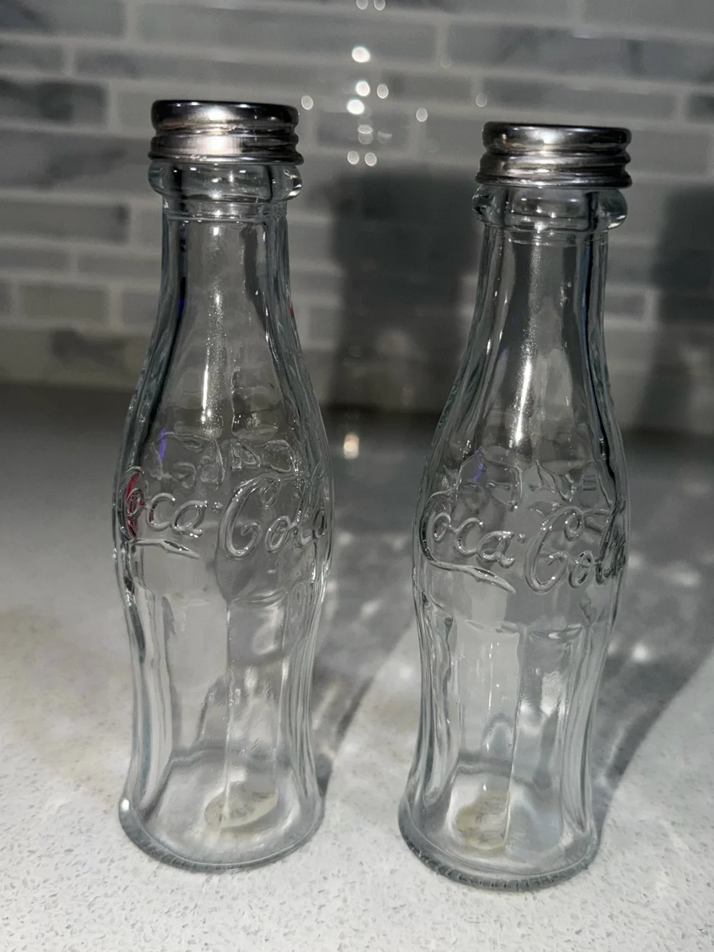 Coca Cola Clear Glass Embossed Salt and Pepper Shaker Bottles with Silver Tops